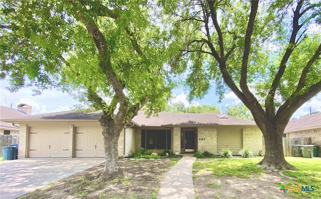 507 Santa Fe, Victoria, TX 77904 - single story home featuring concrete driveway, an attached garage, and brick siding