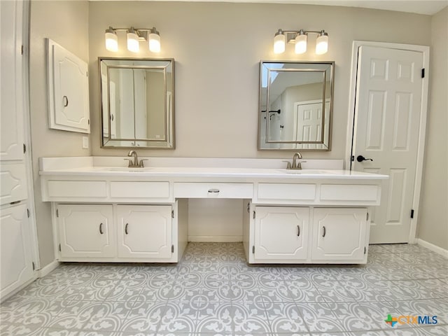 507 Santa Fe, Victoria, TX 77904 - bathroom featuring double vanity and baseboards