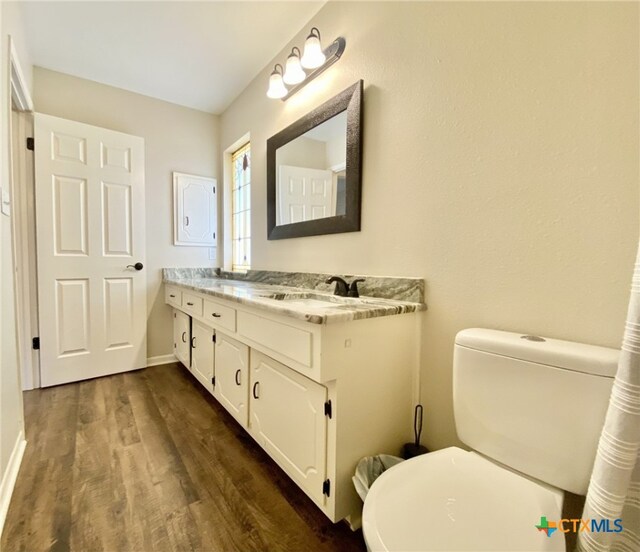 507 Santa Fe, Victoria, TX 77904 - bathroom featuring wood finished floors and double vanity