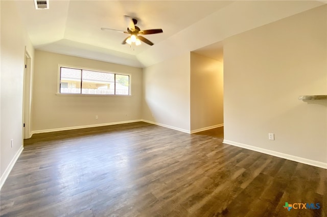 507 Santa Fe, Victoria, TX 77904 - empty room featuring a tray ceiling, ceiling fan, and dark wood-style floors