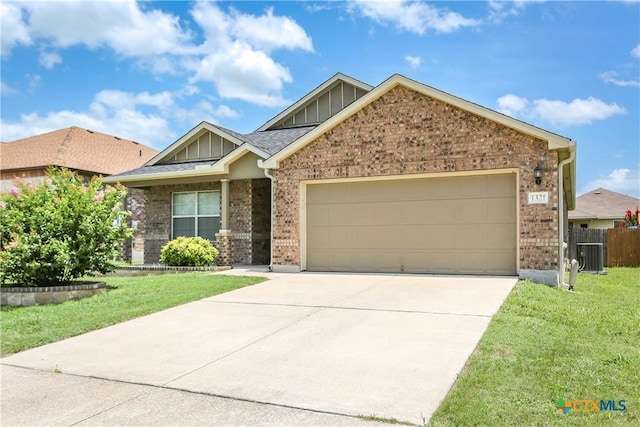 1321 Cozy Creek Dr, Temple, TX 76502 - view of front of home with brick siding, board and batten siding, a garage, and concrete driveway