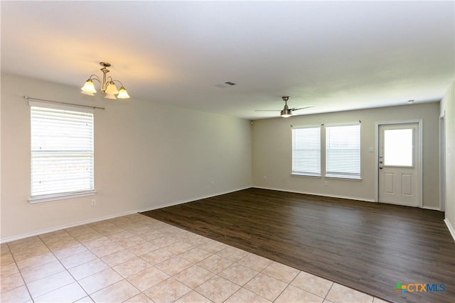1321 Cozy Creek Dr, Temple, TX 76502 - unfurnished room featuring a chandelier, ceiling fan, and light wood-style flooring