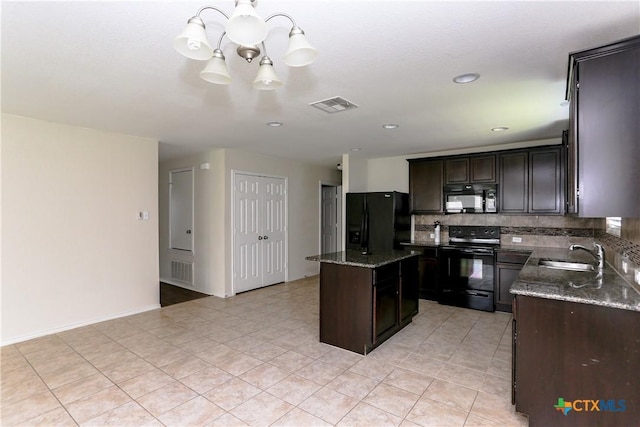 1321 Cozy Creek Dr, Temple, TX 76502 - kitchen featuring black appliances, a chandelier, tasteful backsplash, a center island, and dark stone counters