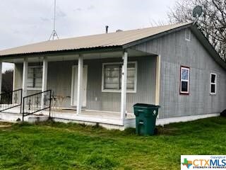 301 Fm 1467 S, Unit S, TX 76890 - back of house with a porch and a lawn
