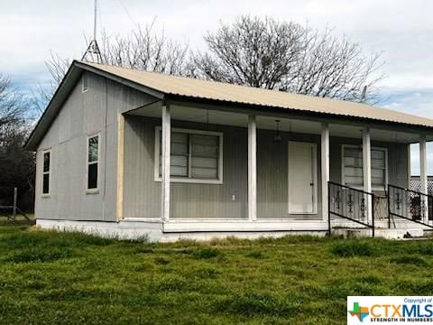 301 Fm 1467 S, Unit S, TX 76890 - back of property with a porch, a yard, and a metal roof