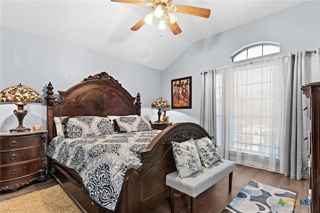 bedroom with light wood-style floors, a ceiling fan, and lofted ceiling