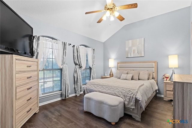bedroom featuring dark wood-style floors, baseboards, a ceiling fan, and lofted ceiling