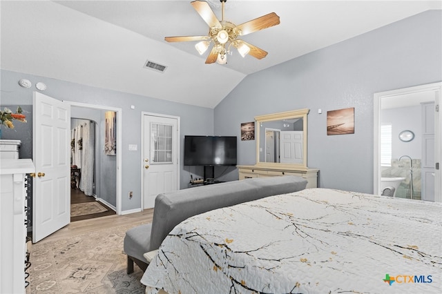 bedroom featuring baseboards, vaulted ceiling, a ceiling fan, visible vents, and wood finished floors