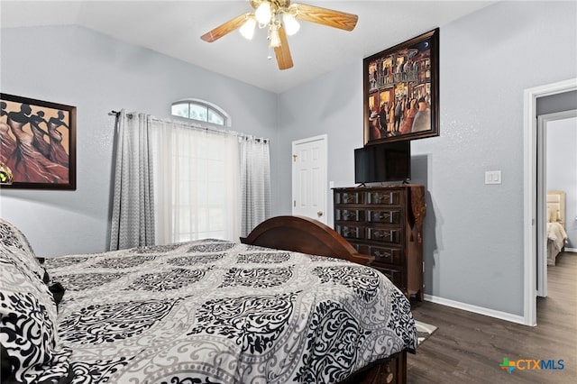 bedroom with ceiling fan, baseboards, vaulted ceiling, and wood finished floors