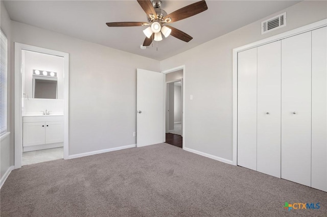 716 S 3rd St, Copperas Cove, TX 76522 - unfurnished bedroom with carpet, a closet, ensuite bath, and a ceiling fan