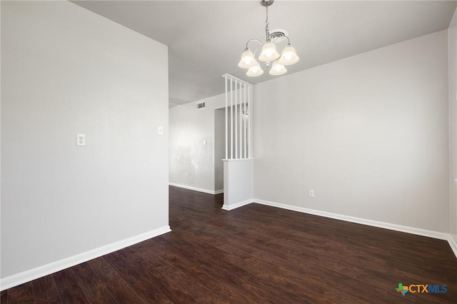 716 S 3rd St, Copperas Cove, TX 76522 - spare room with a chandelier and dark wood-style floors