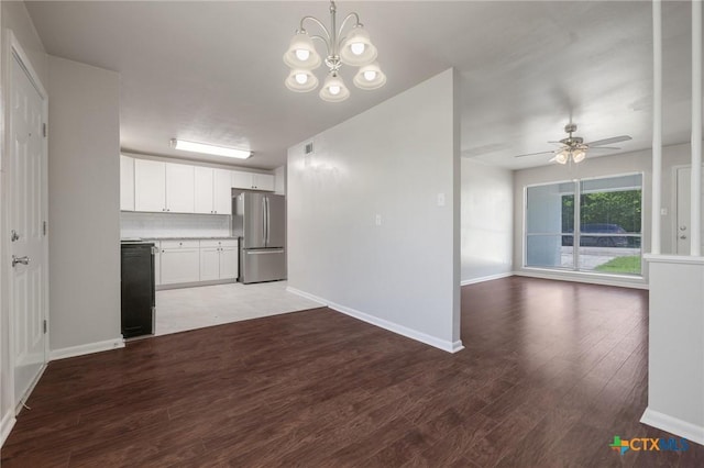 716 S 3rd St, Copperas Cove, TX 76522 - kitchen featuring freestanding refrigerator, open floor plan, light wood-style floors, white cabinets, and a chandelier