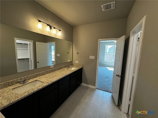 bathroom featuring vanity and tile patterned flooring