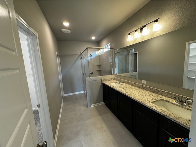 bathroom featuring vanity, tile patterned floors, and an enclosed shower