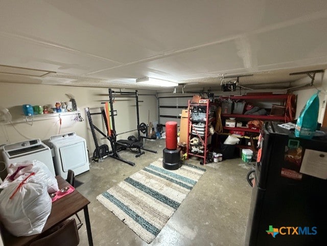 410 Phoenix Dr, Temple, TX 76504 - garage featuring washer and dryer and a garage door opener