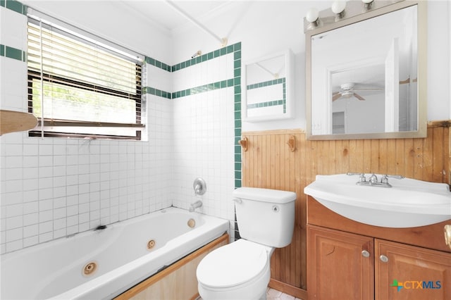 1202 S 3rd St, Copperas Cove, TX 76522 - full bathroom with a wainscoted wall, vanity, ceiling fan, a combined bath / shower with jetted tub, and wood walls