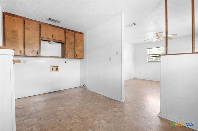 1202 S 3rd St, Copperas Cove, TX 76522 - laundry area with a ceiling fan, a textured ceiling, and hookup for an electric dryer