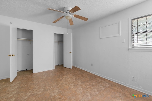 1202 S 3rd St, Copperas Cove, TX 76522 - unfurnished bedroom with multiple closets, tile patterned floors, a textured ceiling, and a ceiling fan