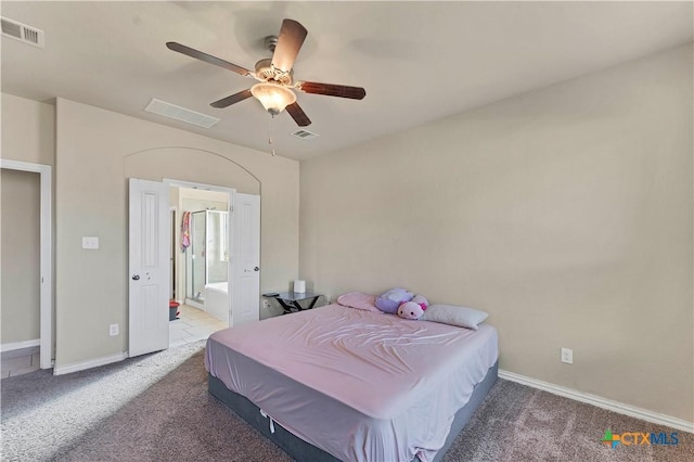 bedroom featuring carpet, ensuite bathroom, and ceiling fan