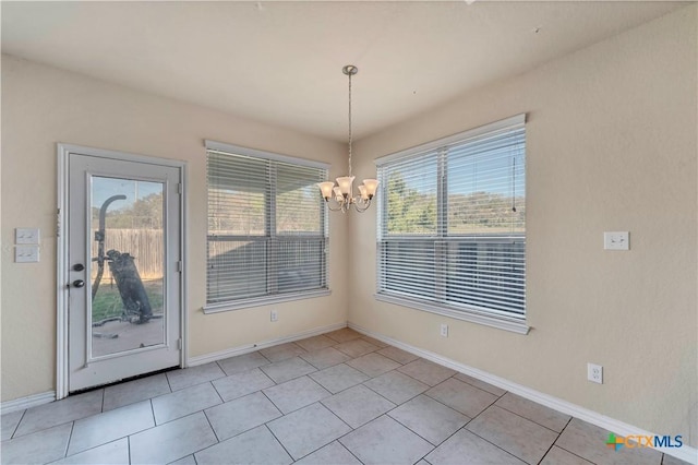 unfurnished dining area featuring light tile patterned floors and an inviting chandelier