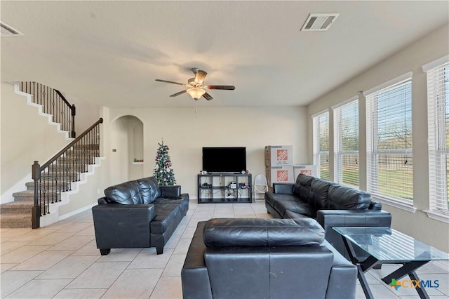 living room featuring ceiling fan and light tile patterned floors