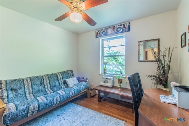 1105 E Robertson Ave, Copperas Cove, TX 76522 - living area featuring wood finished floors, a desk, and a ceiling fan