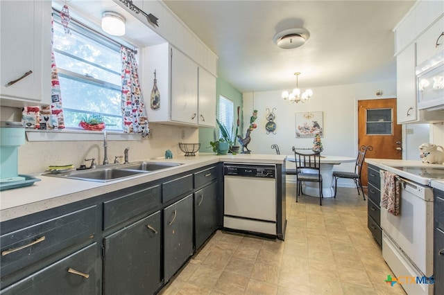1105 E Robertson Ave, Copperas Cove, TX 76522 - kitchen featuring white appliances, white cabinets, light countertops, and a chandelier