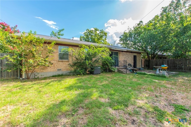 1105 E Robertson Ave, Copperas Cove, TX 76522 - rear view of property with brick siding and a patio