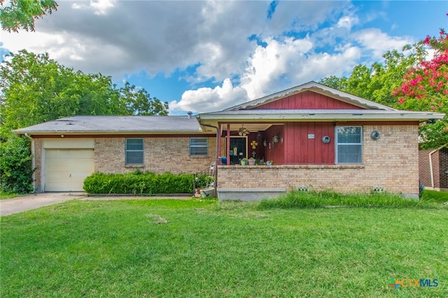 1105 E Robertson Ave, Copperas Cove, TX 76522 - view of front facade featuring brick siding, a front yard, an attached garage, and ceiling fan