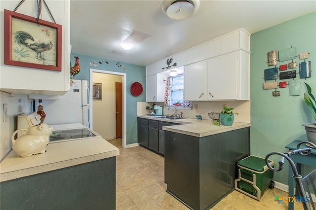 1105 E Robertson Ave, Copperas Cove, TX 76522 - kitchen with light countertops, white cabinetry, white appliances, and light flooring