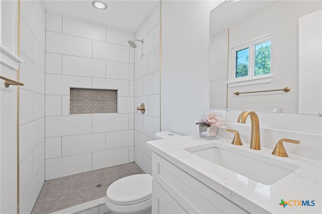 711 Santa Rosa Dr, Killeen, TX 76541 - bathroom featuring tiled shower and vanity
