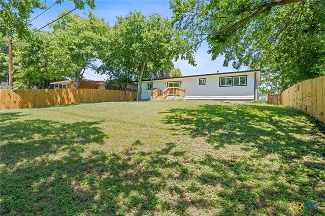 711 Santa Rosa Dr, Killeen, TX 76541 - fenced backyard with a wooden deck