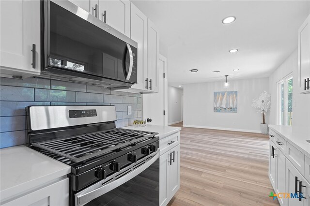 711 Santa Rosa Dr, Killeen, TX 76541 - kitchen featuring stainless steel appliances, light countertops, decorative backsplash, white cabinetry, and recessed lighting