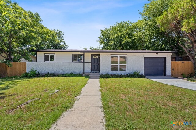 711 Santa Rosa Dr, Killeen, TX 76541 - view of front of home featuring driveway and an attached garage