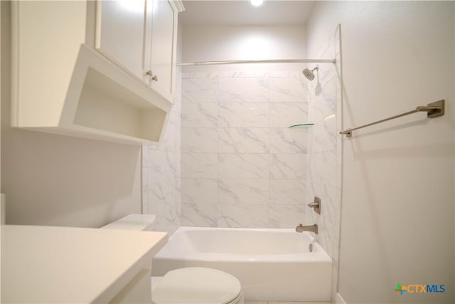 bathroom featuring tub / shower combination, toilet, and vanity