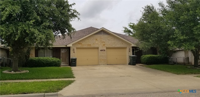 view of front facade with a front lawn and a garage