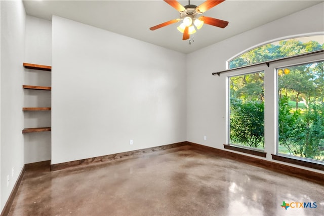 unfurnished room featuring ceiling fan