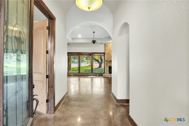 hall featuring concrete flooring