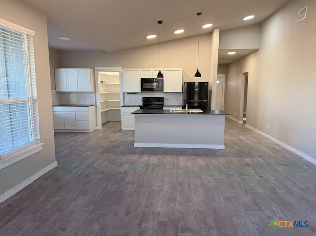 kitchen featuring white cabinetry, hanging light fixtures, dark hardwood / wood-style flooring, high vaulted ceiling, and black appliances