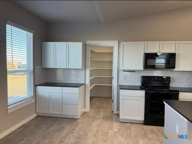 kitchen with black appliances, white cabinets, light wood-type flooring, and tasteful backsplash