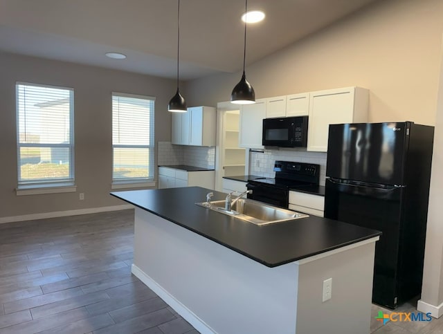 kitchen with sink, a center island with sink, white cabinetry, and black appliances