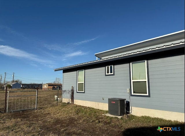 view of home's exterior featuring central air condition unit