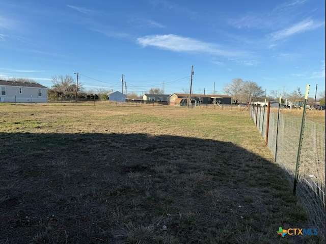 view of yard with a rural view