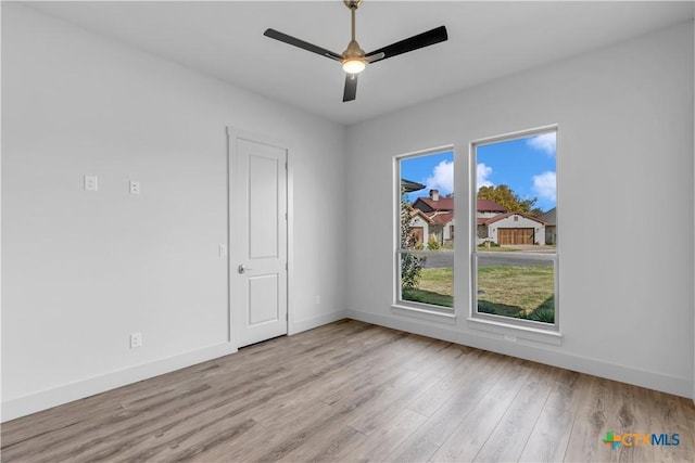 105 Gillespie Ct, Horseshoe Bay, TX 78657 - empty room with baseboards, a ceiling fan, and wood finished floors