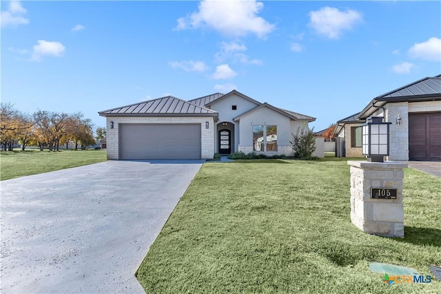 105 Gillespie Ct, Horseshoe Bay, TX 78657 - view of front facade with a standing seam roof, concrete driveway, metal roof, and a garage