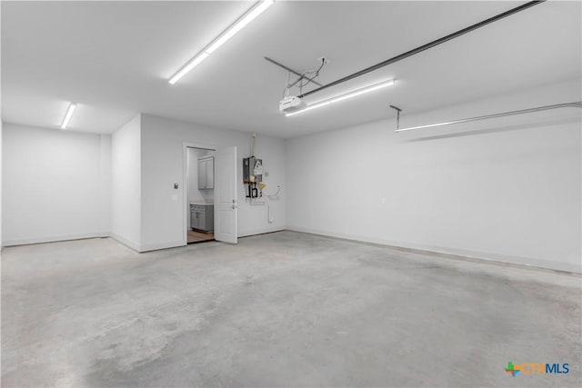 105 Gillespie Ct, Horseshoe Bay, TX 78657 - garage featuring a garage door opener and baseboards