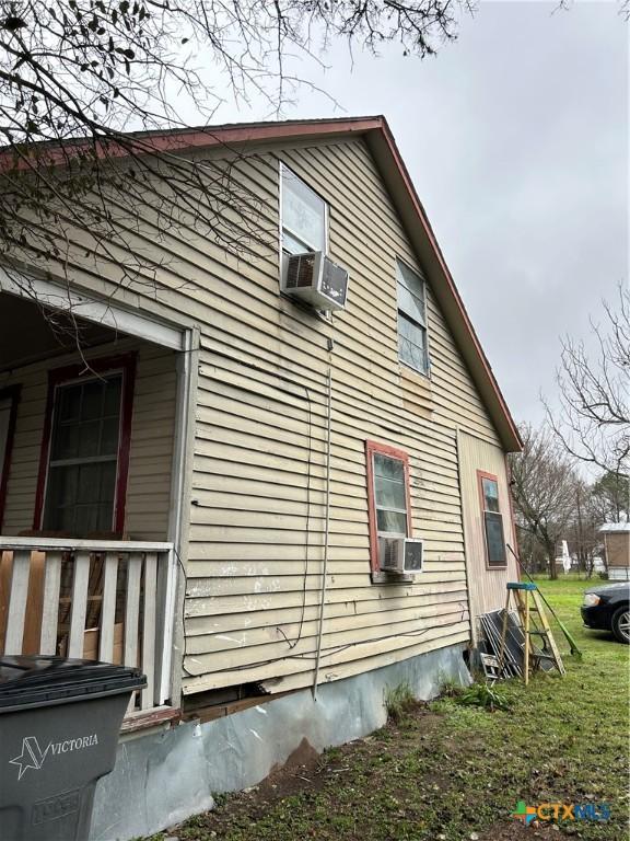 view of side of property featuring cooling unit