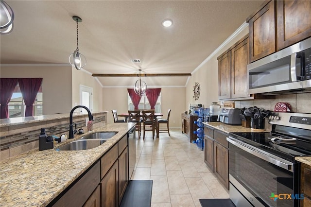 6105 Dorado Dr, Killeen, TX 76542 - kitchen featuring stainless steel appliances, crown molding, a sink, decorative backsplash, and pendant lighting