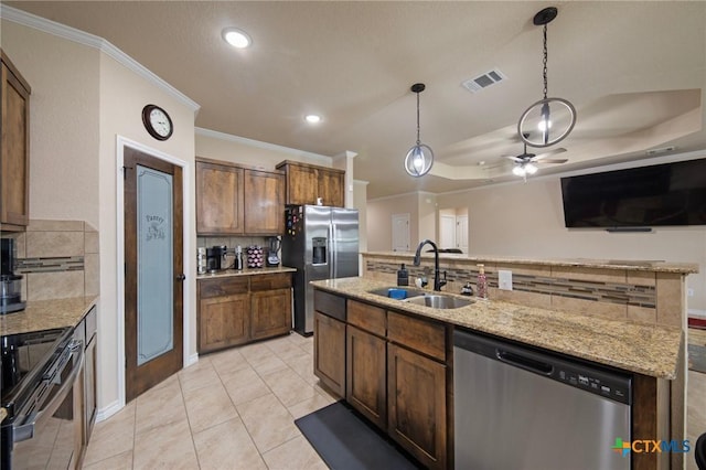 6105 Dorado Dr, Killeen, TX 76542 - kitchen featuring crown molding, stainless steel appliances, tasteful backsplash, and a sink