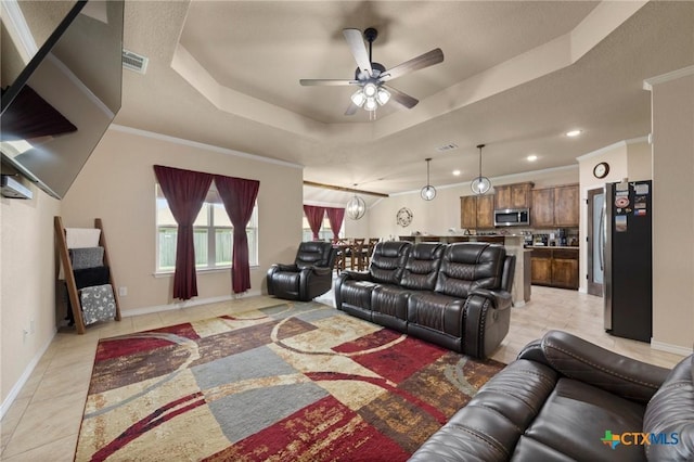6105 Dorado Dr, Killeen, TX 76542 - living area with a ceiling fan, a raised ceiling, baseboards, and light tile patterned floors